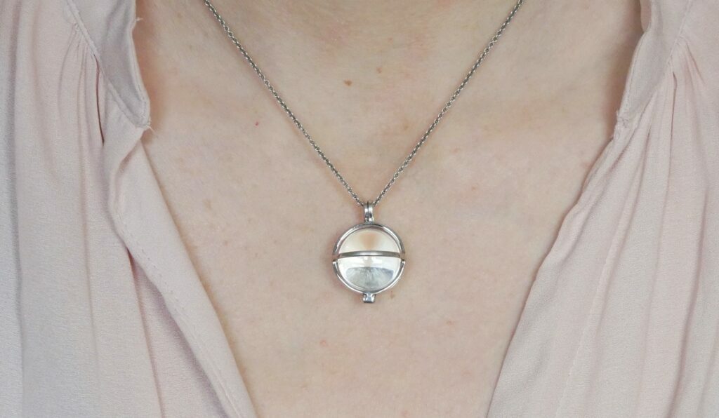 energetically charged jewelry (small Primordial Light  sphere) on a chain of your choice